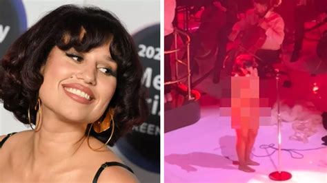 Raye strips off on stage in front of fans to share ‘her only body’